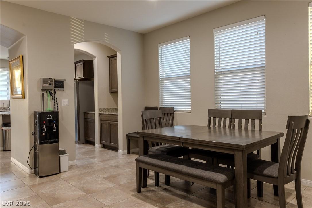 Image 4: This inviting dining area features a warm ambiance