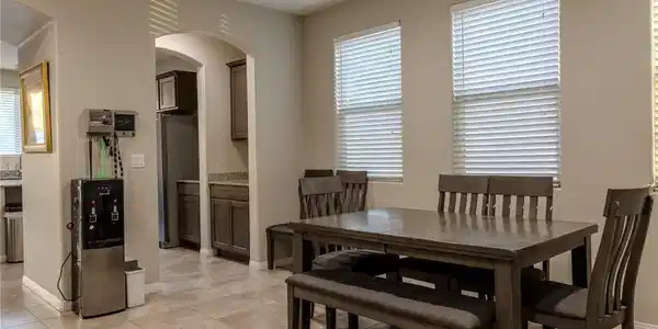 Image 4: This inviting dining area features a warm ambiance