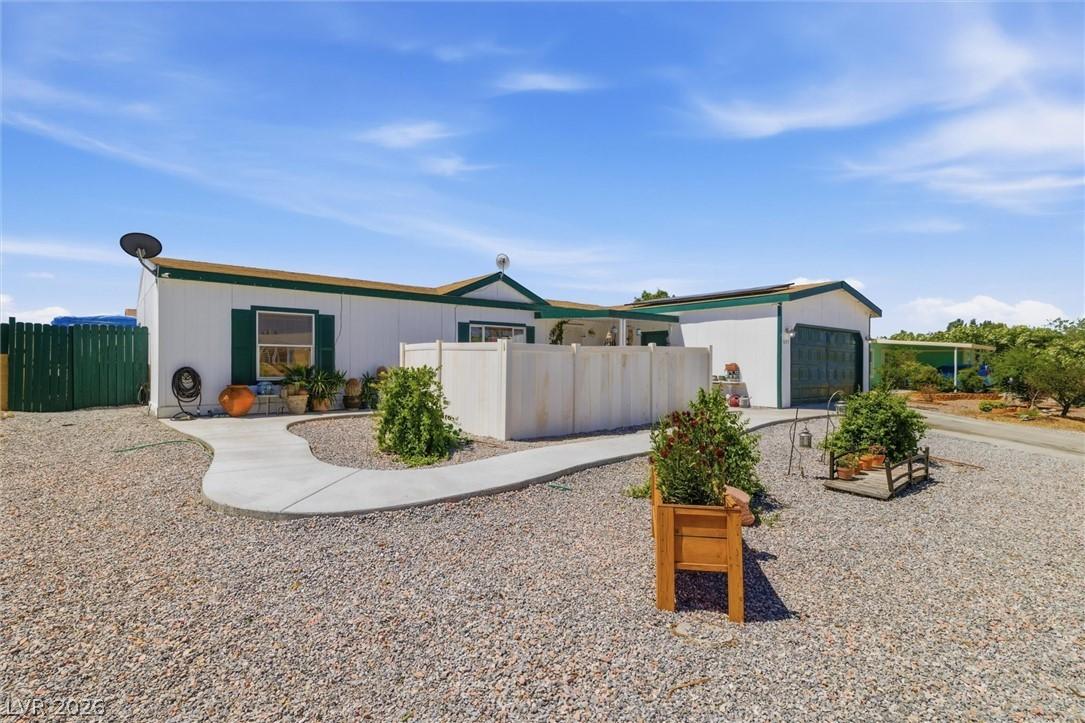 Image 3: A well-maintained residence features a concrete pa