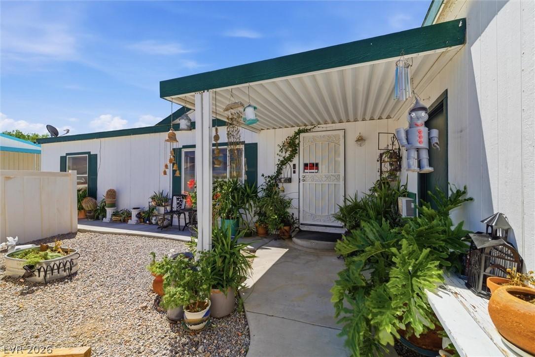 Image 4: A well-maintained manufactured home with a covered