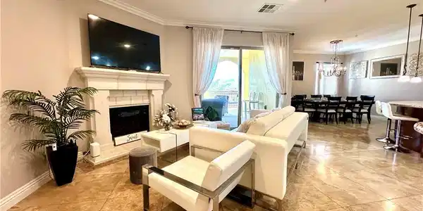 Image 4: The generously proportioned living room features a