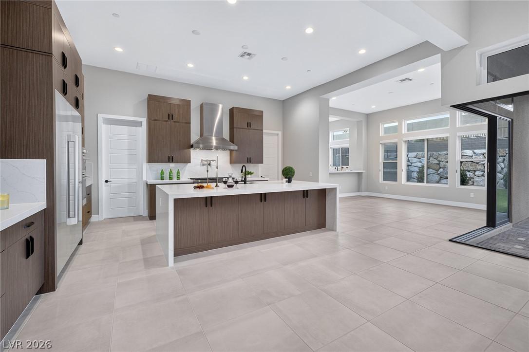 Image 2: A well-appointed kitchen featuring a substantial i
