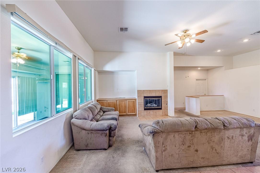 Image 4: A well-lit gathering space, featuring a tiled fire