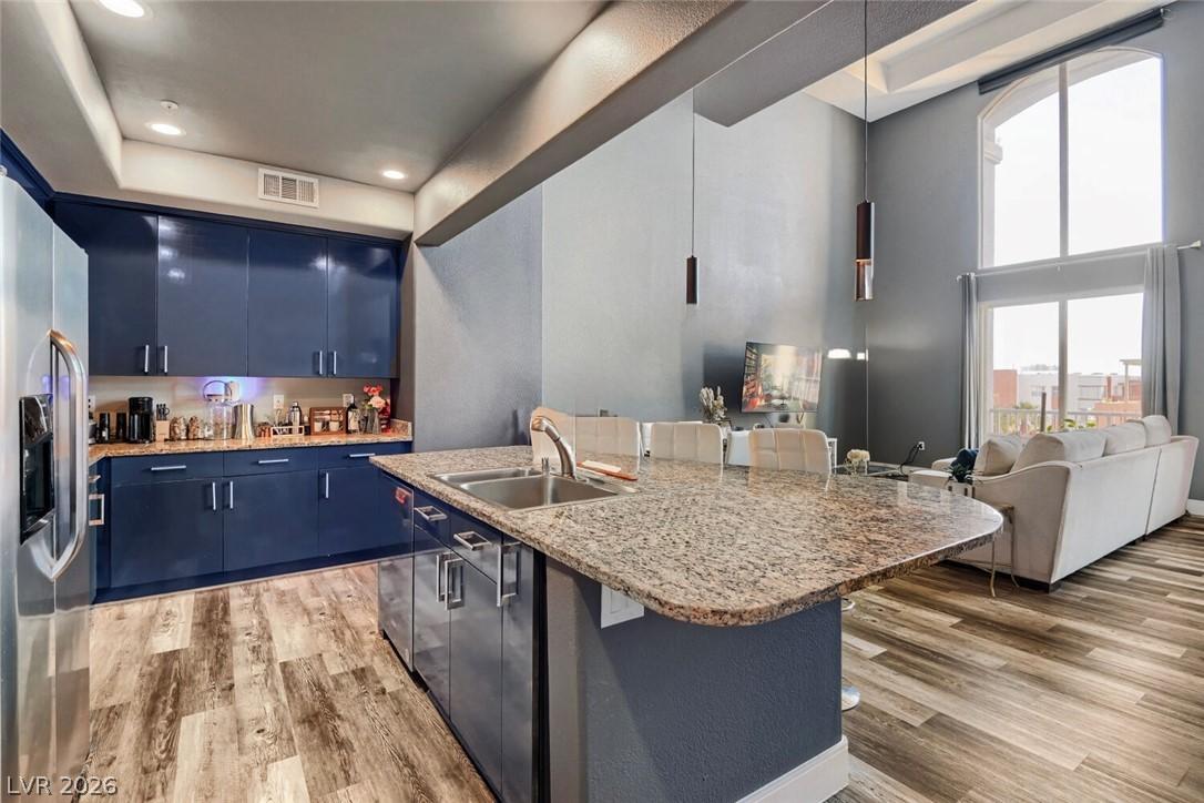 Image 3: Kitchen and living space seamlessly connect with m