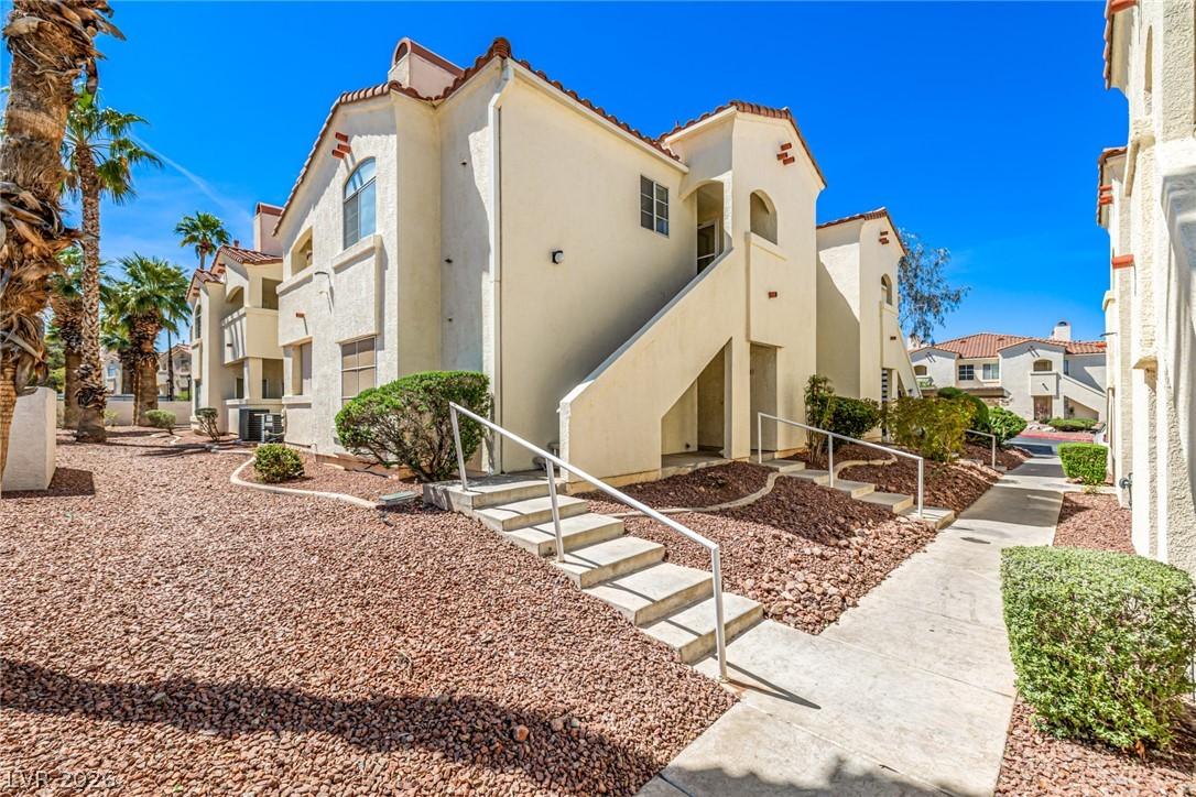 Image 3: View of property with stairs and a residential vie