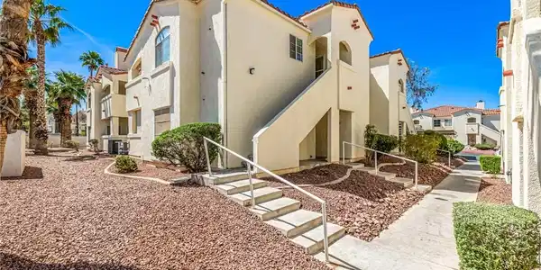 Image 3: View of property with stairs and a residential vie