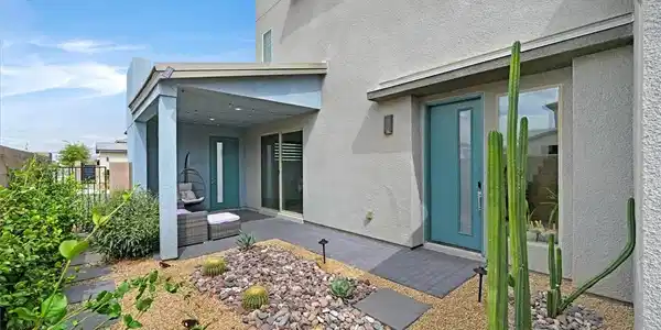 Image 2: Desert landscaping and stone pathways guide guests