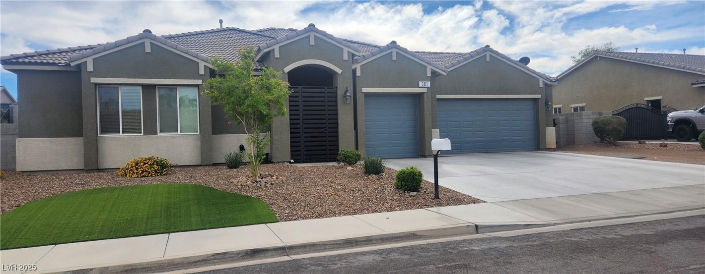 Image 1: Ranch-style home with stucco siding, driveway, and