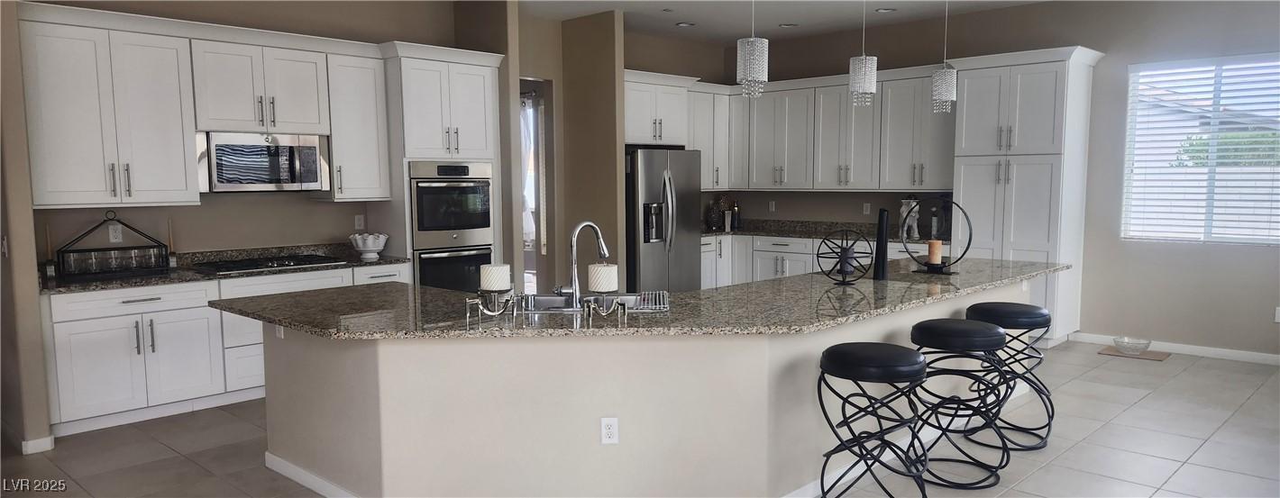 Image 4: Kitchen featuring light tile patterned flooring, w