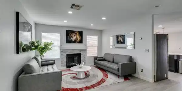 Image 4: A refined living space features a tiled fireplace,