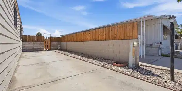 Image 3: Concrete driveway runs alongside the structure bor