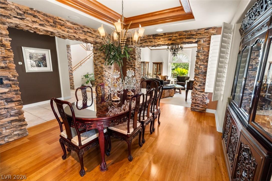Image 3: Elegant hardwood flooring grounds a refined dining