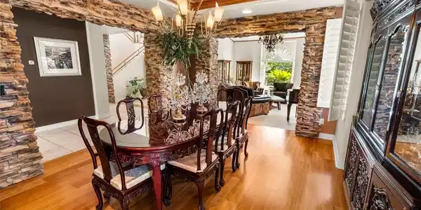 Image 3: Elegant hardwood flooring grounds a refined dining