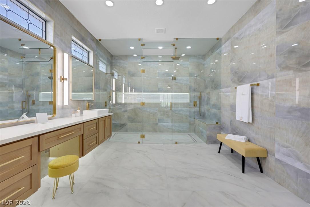 Image 1: Luxurious walk-in shower and elegant vanity define