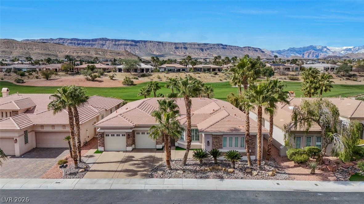 Image 2: A desert oasis, this property sits amidst green fa