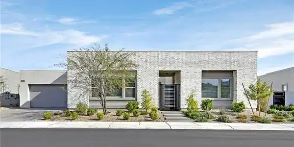 Image 2: Modern facade with sleek brickwork, integrated gar