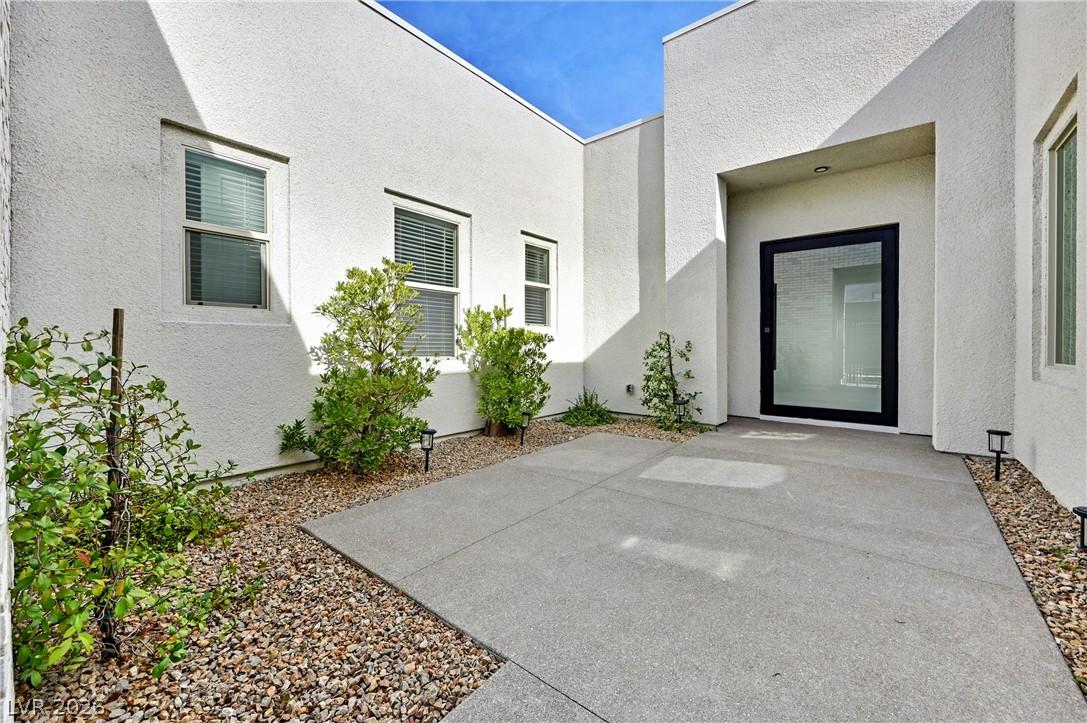 Image 3: A modern exterior facade featuring a minimalist de