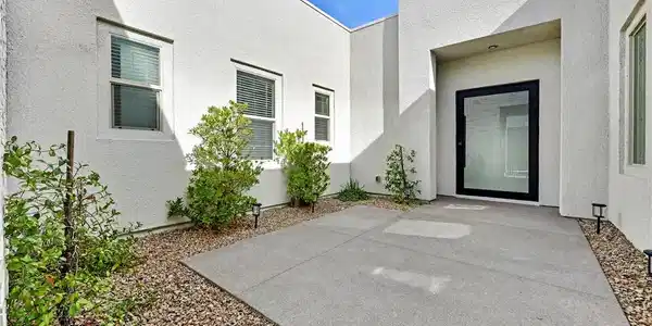 Image 3: A modern exterior facade featuring a minimalist de