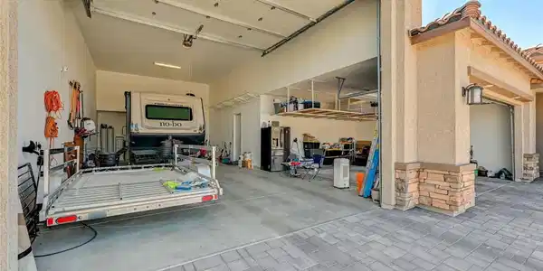 Image 3: A RV garage featuring high ceilings, ample storage