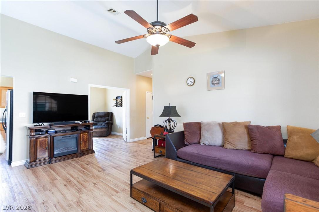 Image 4: A well-lit gathering space with vaulted ceilings a