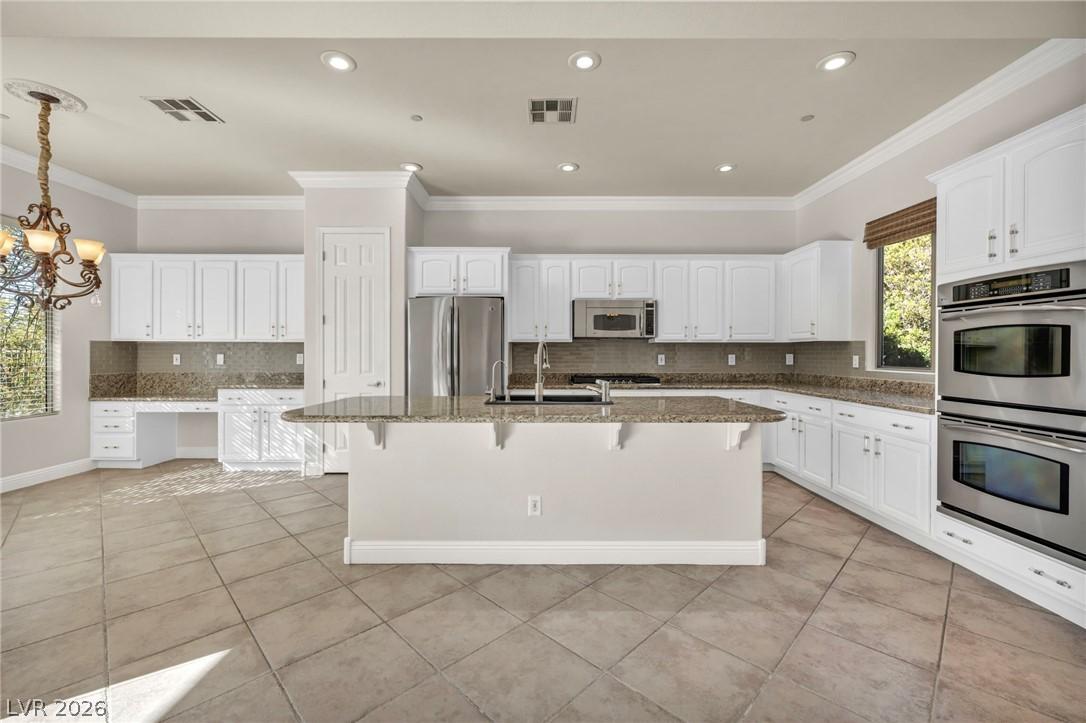 Image 1: Kitchen with stone counters, visible vents, light