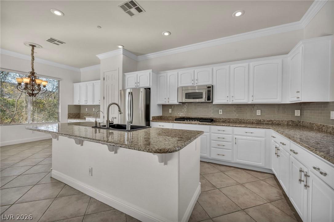 Image 4: Kitchen featuring light tile patterned floors, sto