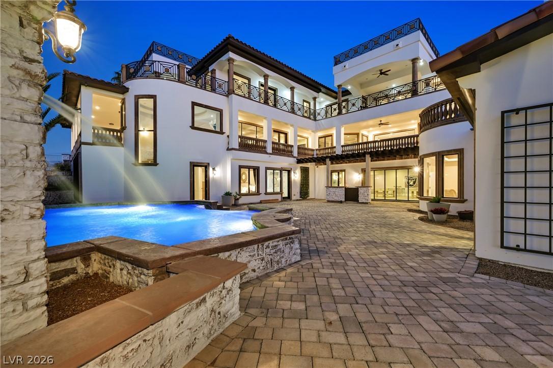 Image 4: A grand estate with multi-level balconies surround