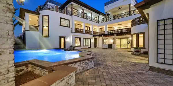 Image 4: A grand estate with multi-level balconies surround