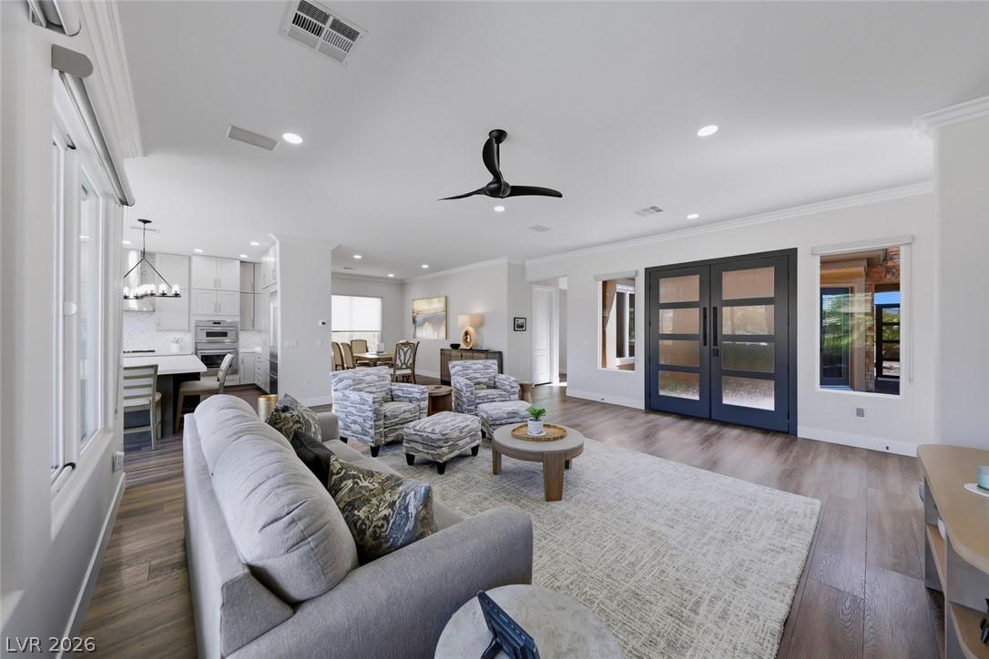 Image 1: Natural light floods this inviting living space, c
