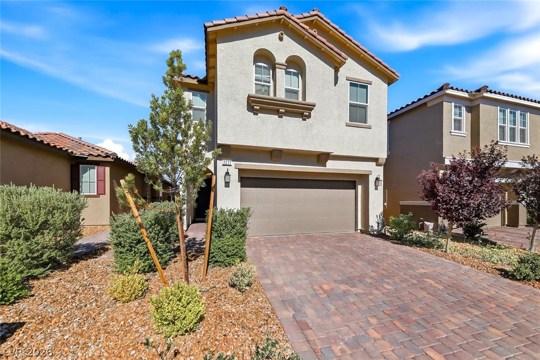 Image 3: A welcoming front exterior showcasing stucco sidin
