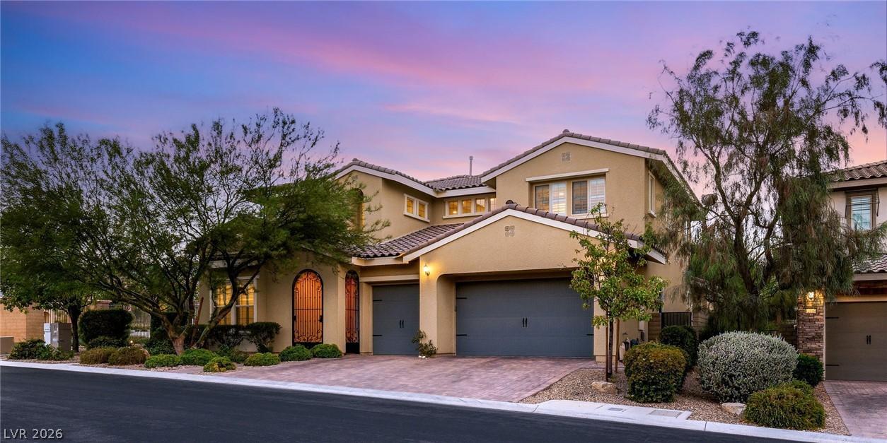 Image 2: Dramatic sunset hues enhance this home's tiled roo