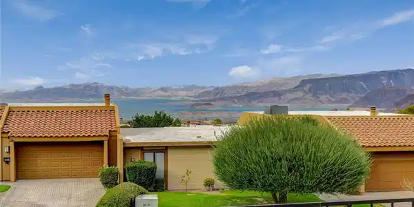 Image 4: An inviting exterior with nestled against a mounta