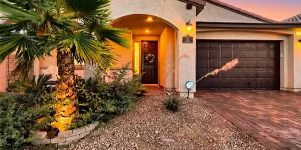 Image 4: A desert community entry with a stone sign, well-m