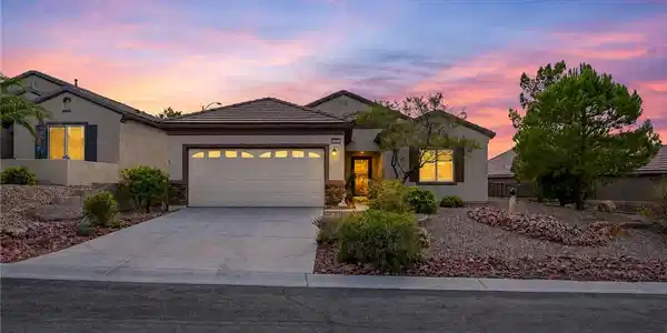 Image 2: **Virtual Twilight** A classic stucco exterior sit