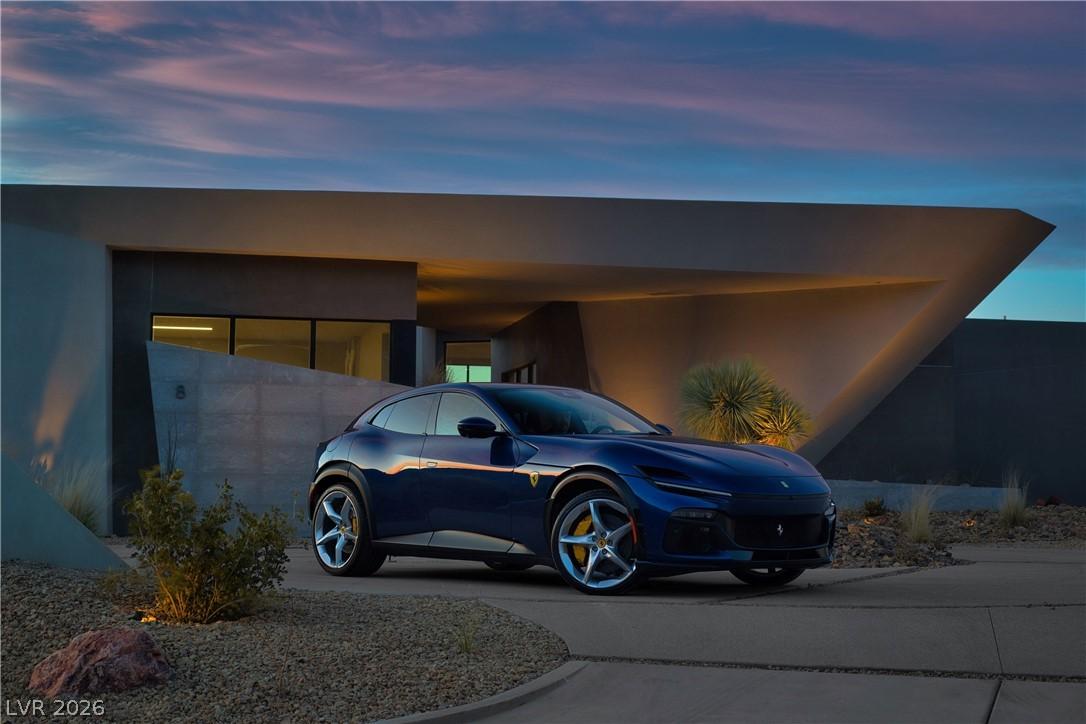 Image 4: This sleek, modern residence features a striking g