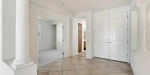 Image 3: Classical columns frame a welcoming entry featurin
