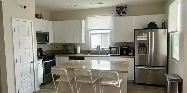 Image 3: Recessed lighting and a center island enhance this