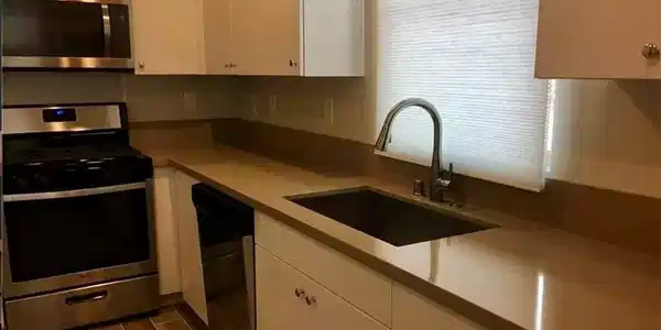 Image 4: Smooth solid-surface countertops pair elegantly wi