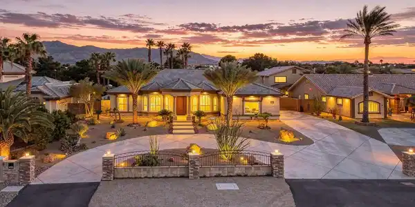 Image 2: An elegant circular driveway and manicured desert