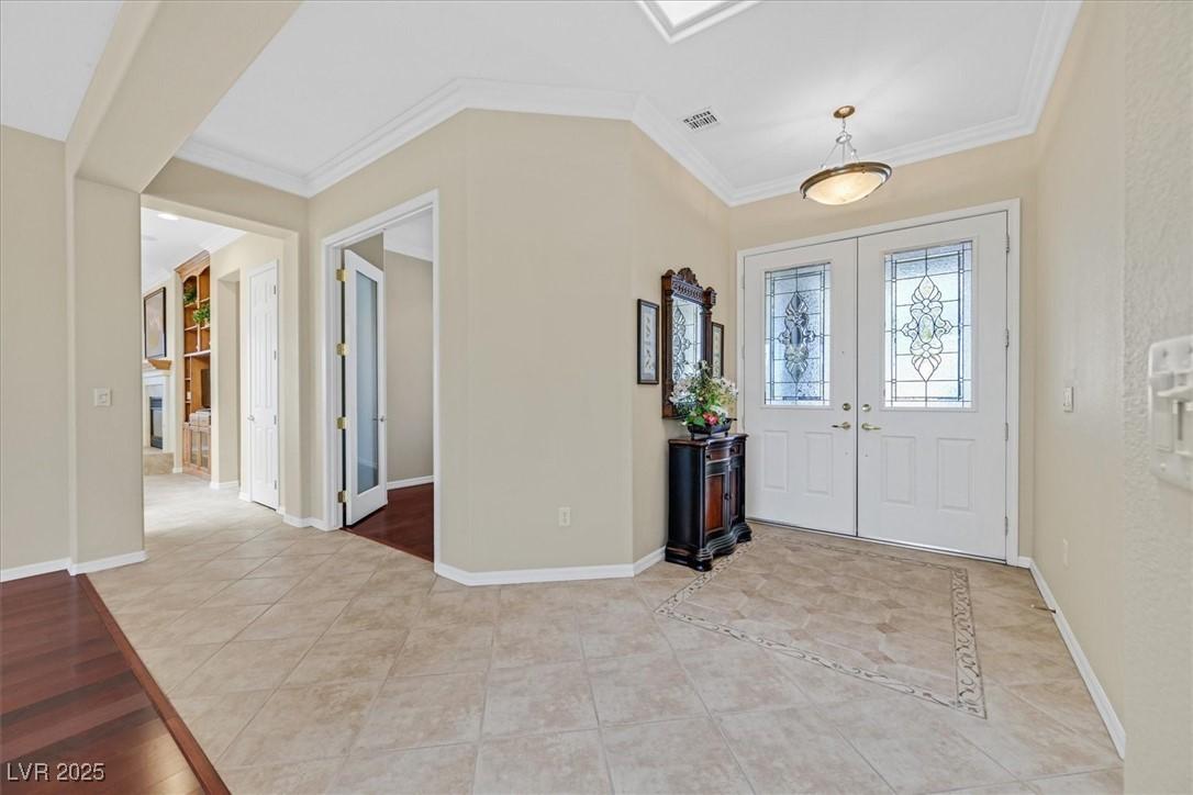 Image 4: Foyer entrance featuring crown molding and light t