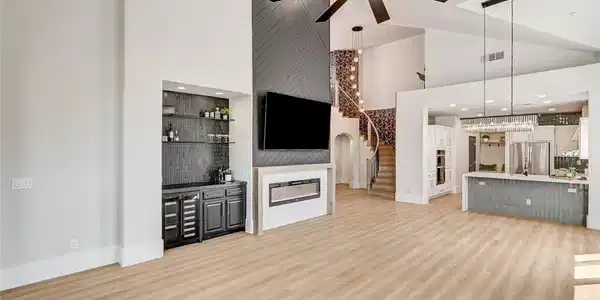 Image 4: Soaring ceilings and light wood floors define this