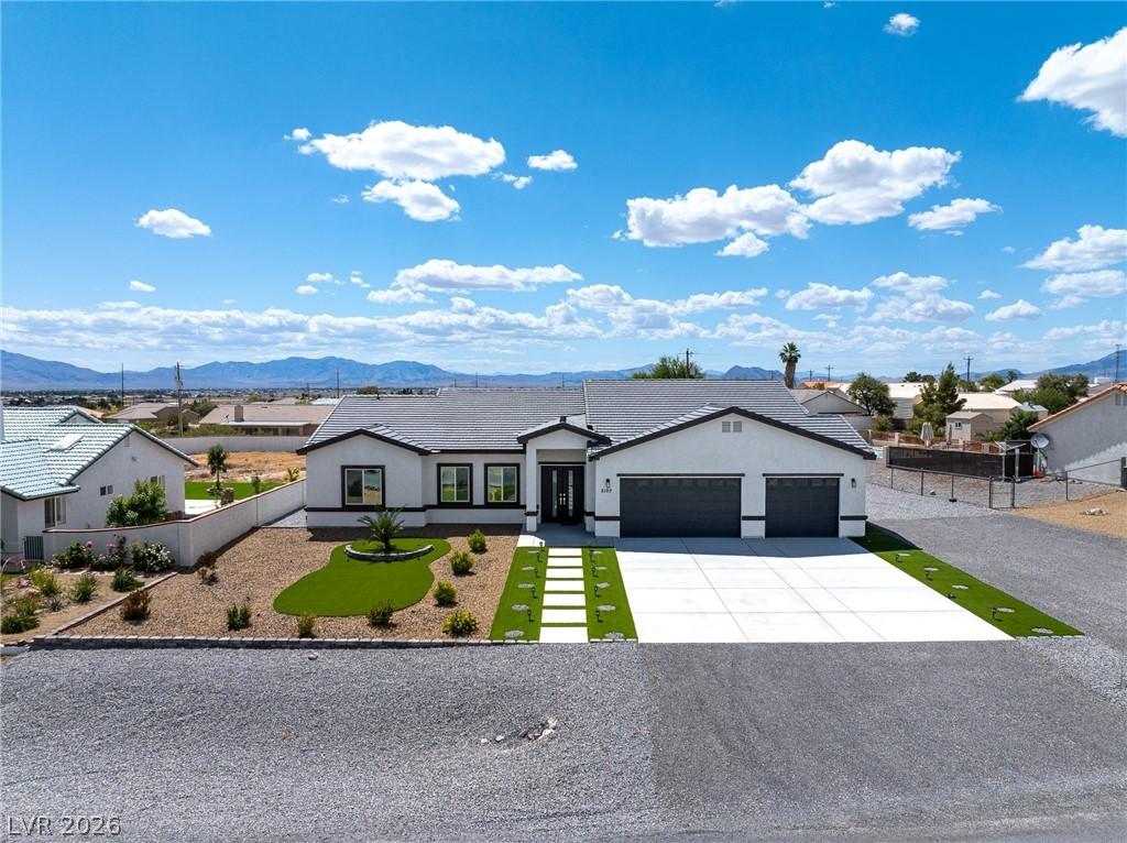 Image 2: An upgraded custom home with striking black trim a