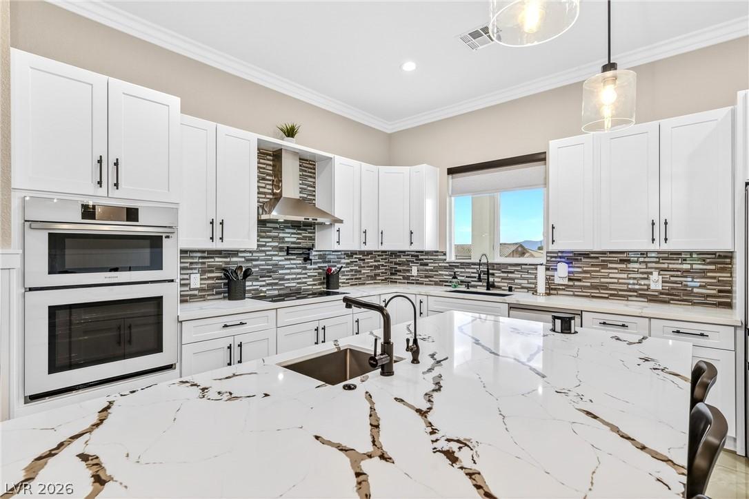 Image 3: Culinary dreams come alive in this kitchen, featur