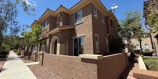Image 2: This charming residence features stucco constructi