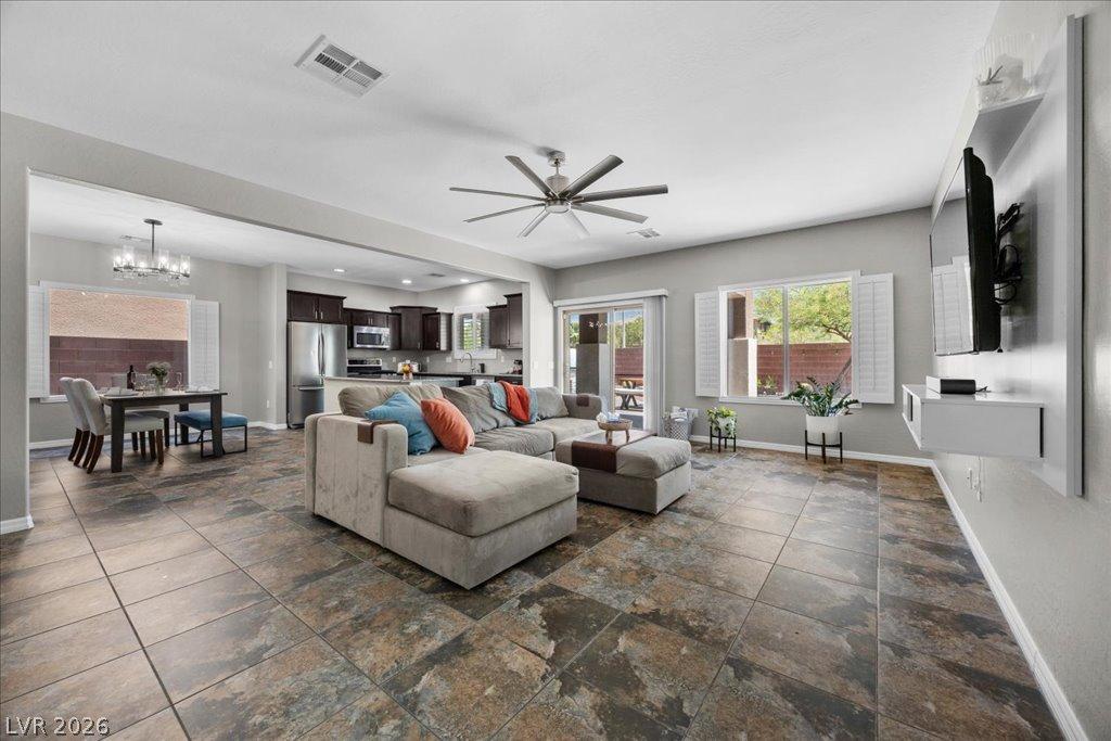 Image 4: An open-concept layout unites the kitchen, dining,