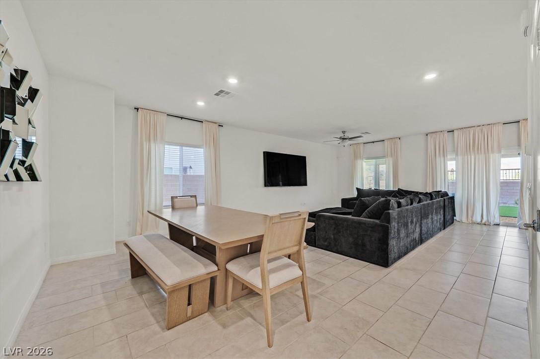Image 4: A spacious, open-concept living area with abundant