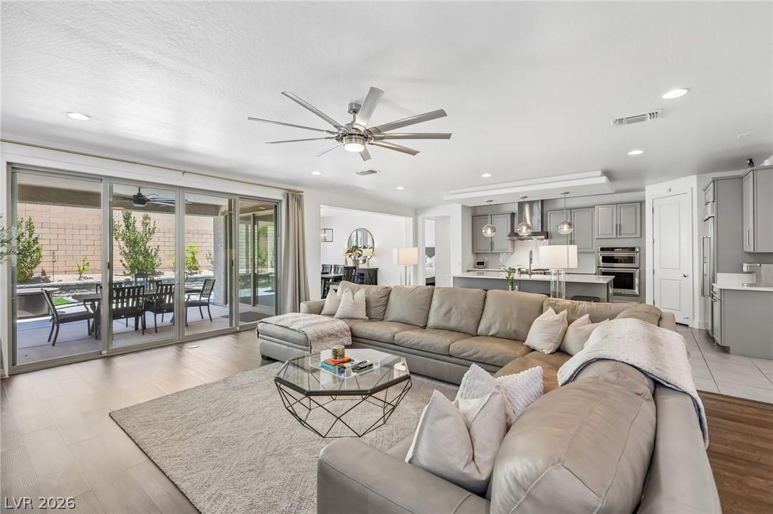 Image 1: An open floor plan seamlessly connects the kitchen