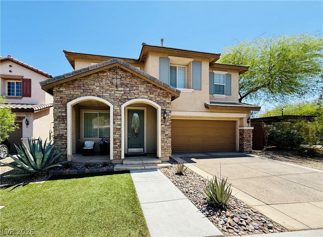 Image 2: A welcoming stone-accented facade introduces this