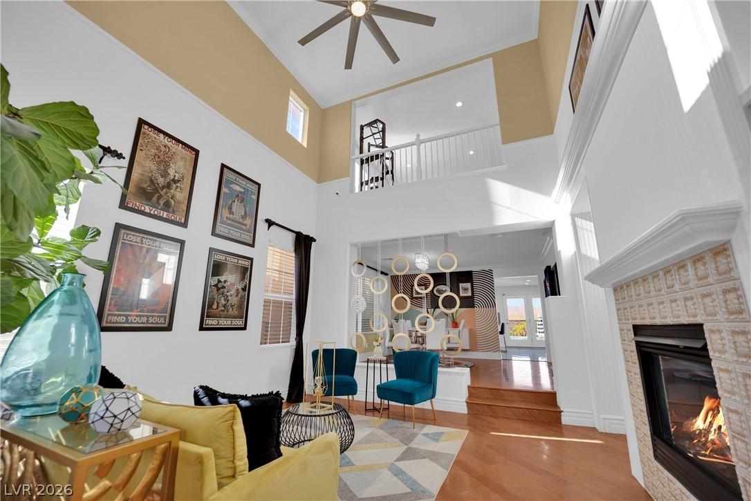 Image 3: High ceilings and a cozy fireplace create an invit