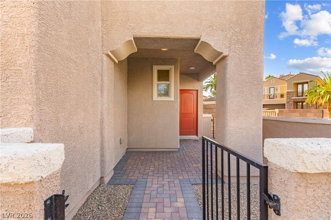 Image 4: An inviting entryway with a decorative archway and